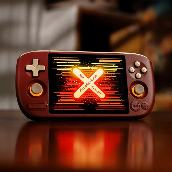 Az Ayaneo Pocket Air Mini Arcade Home Limited Edition piros burkolattal és arany színű kezelőszervekkel rendelkezik.