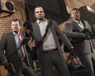 A Grand Theft Auto V főszereplői, Michael, Trevor és Franklin egy rablási küldetésen fegyverekkel és táskákkal. (Kép forrása: Rockstar Games)