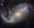 Az NGC 1672 galaxist és a világegyetemben lévő csillagokat ábrázoló kép. (Kép forrása: WikiImages - Pixabay)