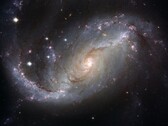 Az NGC 1672 galaxist és a világegyetemben lévő csillagokat ábrázoló kép. (Kép forrása: WikiImages - Pixabay)