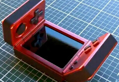 Nem világos, hogy ki alkotta meg ezt a furcsa kagylóhéjú játékkéziszámítógépet. (Kép forrása: via Nittrx)