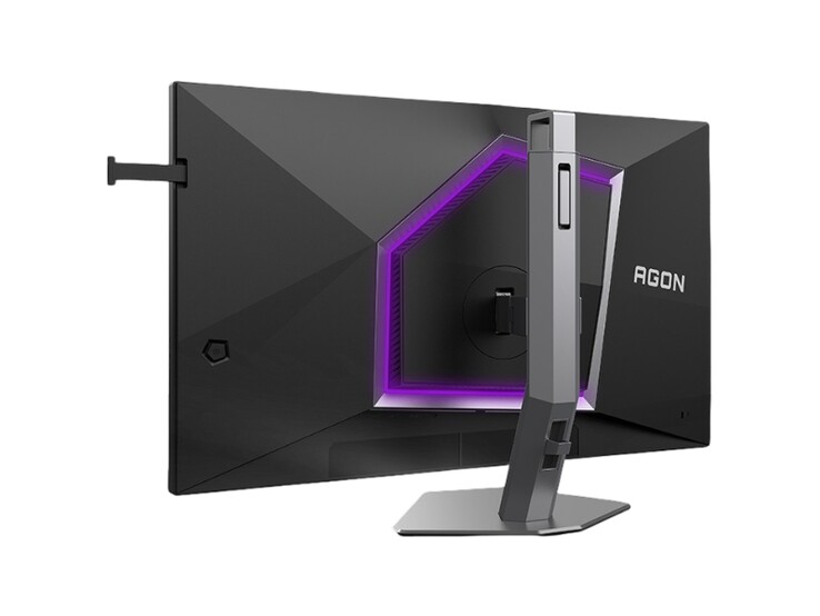 A képen az AOC Agon Pro AG276UZ gamer monitor hátulja látható, amely lila RGB-vel díszített, kifejezetten gameres kialakítású. 