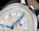 A Timex Marlin Neo Classic Chronograph krém színű számlapjának közeli képe, kék mutatókkal és arab számokkal, piros tachyméter-jelölésekkel, valamint a külső szélén körbefutó kék távmérő-skálával.