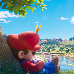 A kozmikus kaland előtti csendes pillanatban Mario egy technicolor fa alatt szundikál - a The Super Mario Galaxy Movie-ban a csillagközi vihar előtti nyugalomban.
