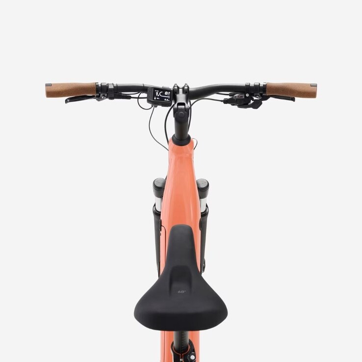 A Decathlon Peach Orange Rockrider E-ACTV 500 e-bike
