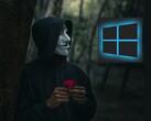 Guy Fawkes-maszkot viselő személy egy Windows-logót néz (Kép forrása: Peakpx és Ahmed Zayan via Unsplash; szerkesztve)