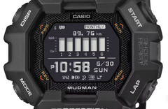 Casio G-Shock Mudman GDG-B100 karóra piros és fehér digitális kijelzővel, zord hegyvidéki táj előtt.