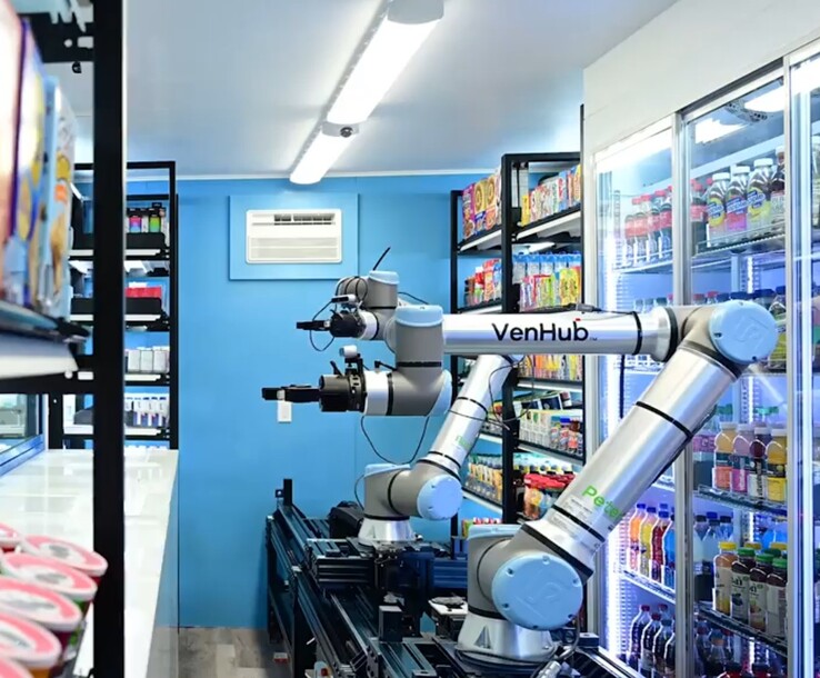 A Venhub üzletek két mesterséges intelligenciával működő robotot használnak, amelyek egy hosszú fémpályán haladva teljesítik a vásárlók megrendeléseit a nap 24 órájában. (Kép forrása: Venhub)